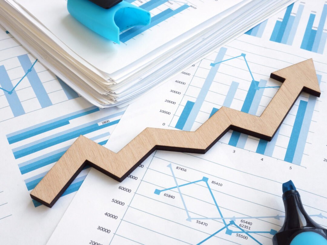 Business growth concept. Financial report with graphs and arrow.